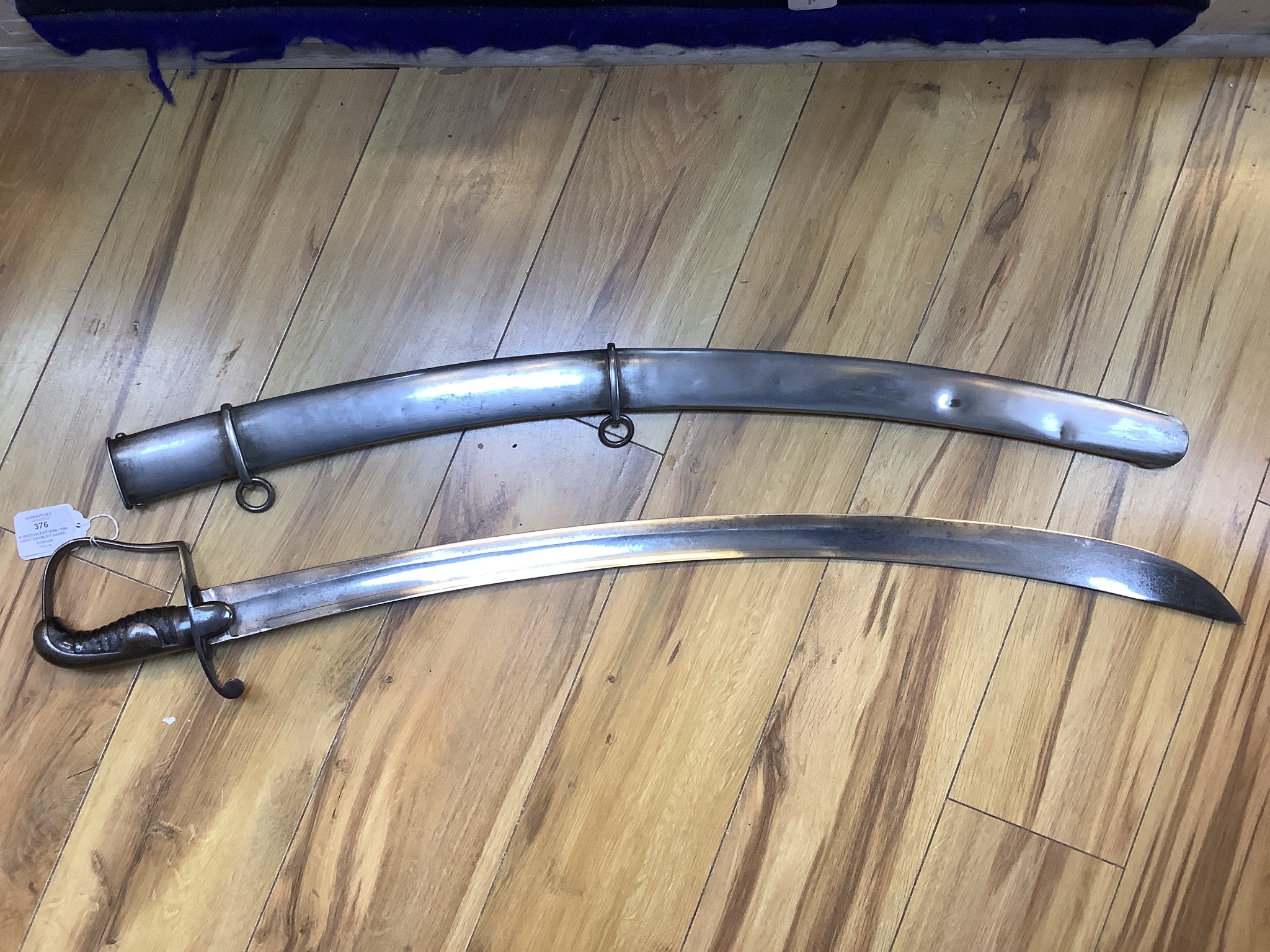 A British pattern 1796 light cavalry sabre, ‘W.S.R.’ engraved to hilt and ‘Bats’? to spine, with steel scabbard. 99cm total length
